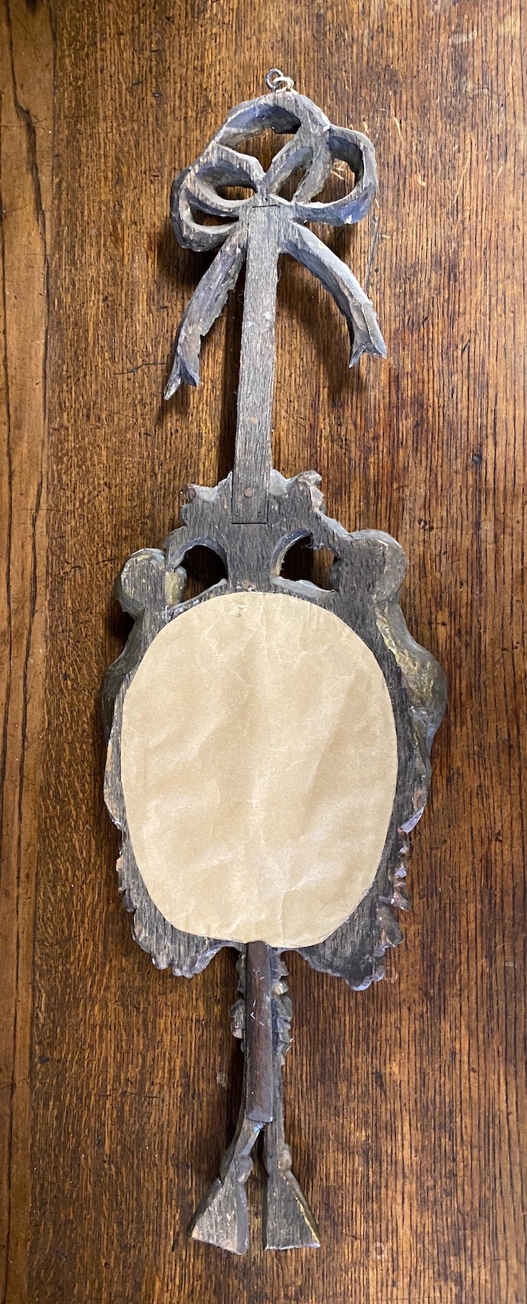 An 18th century style carved giltwood and composition cherub mirror, height 78cm